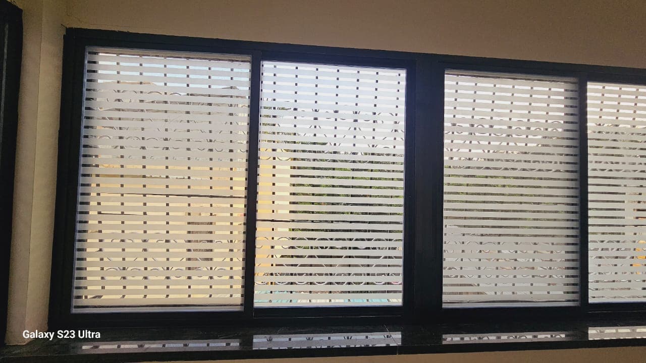 Installed aluminium sliding window with frosted glass panels